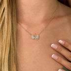 Toi et Moi Pear and Emerald Cut Lab Grown Diamond Halo Necklace (1-3/8ctw) — MET-WN-0047 — source LGYFN0015-hand.jpg