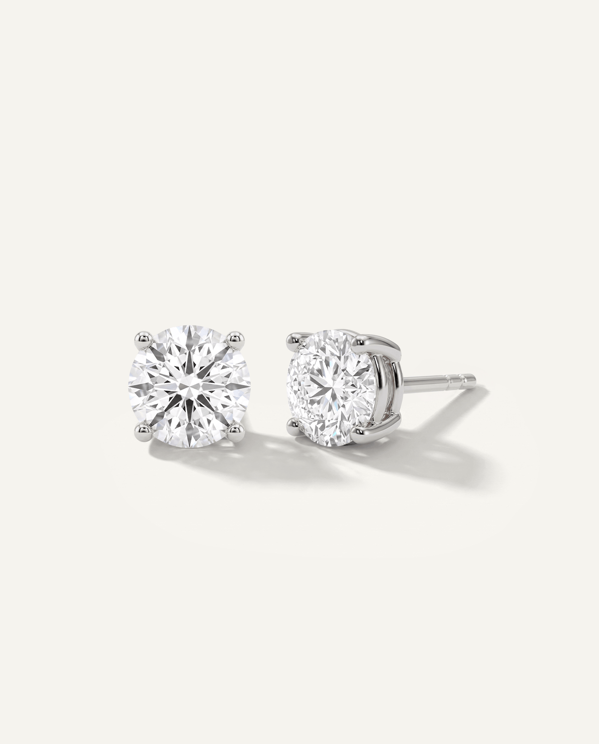 Round lab-grown diamond stud earrings in white gold, front and side view | MET-RE-0004-M10