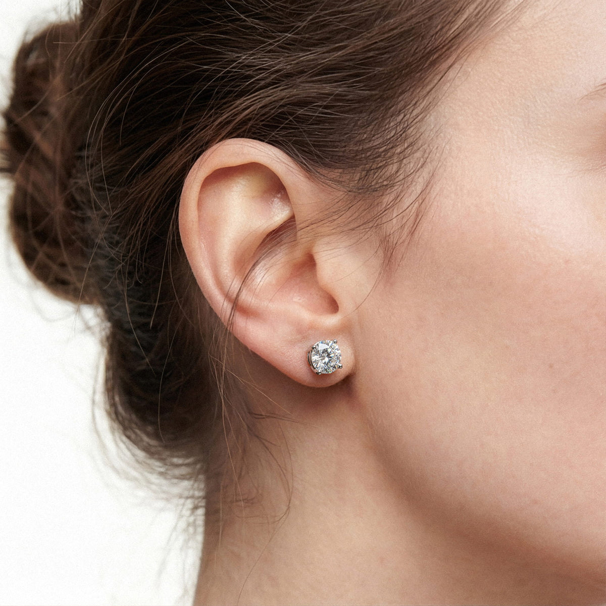 Lab-grown diamond stud earrings worn for styling; additional jewelry is not included | MET-RE-0004-M11