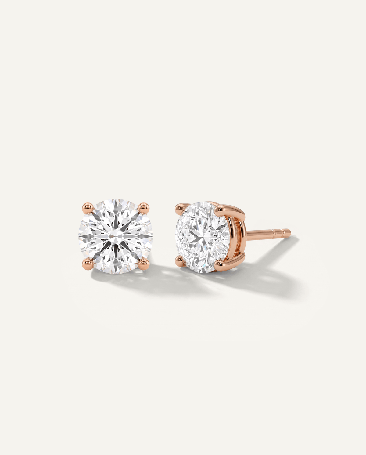 Round lab-grown diamond stud earrings in rose gold, front and side view | MET-RE-0004-M15