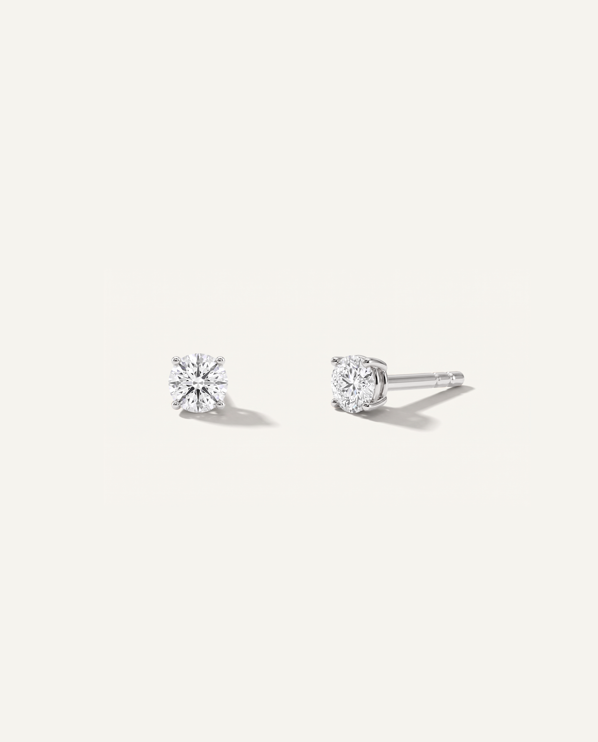 Round lab-grown diamond stud earrings in white gold, front and side view | MET-RE-0004-M16