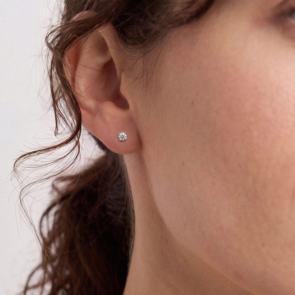 Lab-grown diamond stud earrings worn for styling; additional jewelry is not included | MET-RE-0004-M19