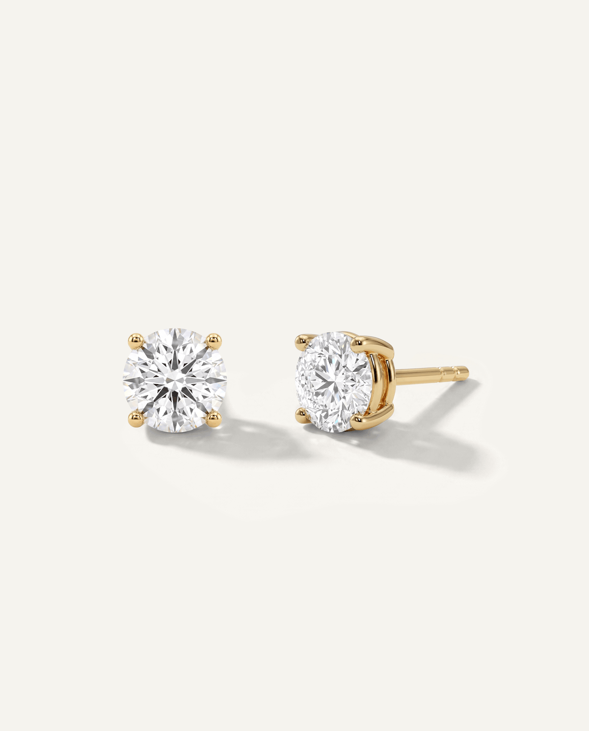 Round lab-grown diamond stud earrings in yellow gold, front and side view | MET-RE-0004-M26