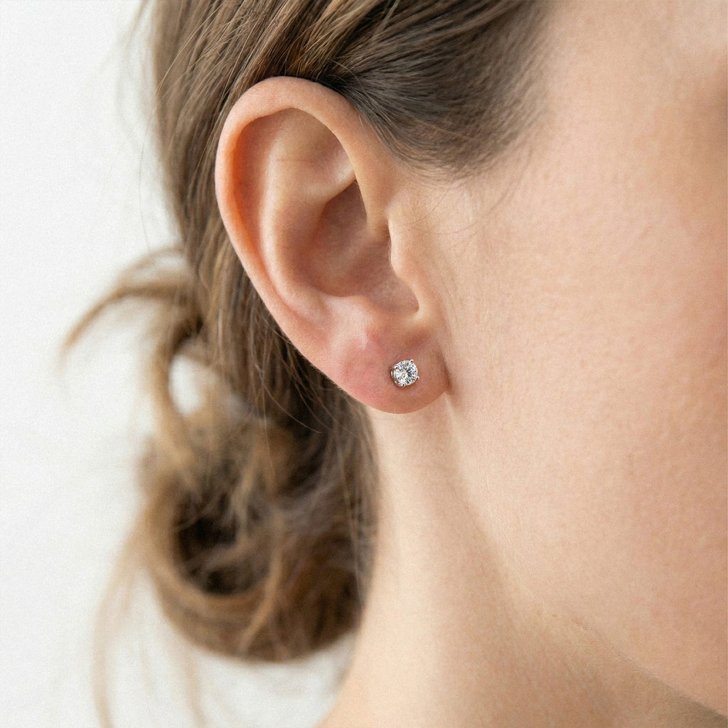 Lab-grown diamond stud earrings worn for styling; additional jewelry is not included | MET-RE-0004-M28