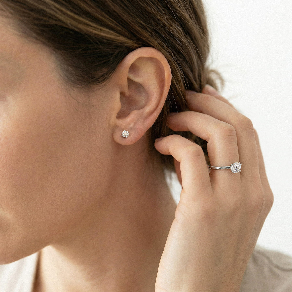 Lab-grown diamond stud earrings worn for styling; additional jewelry is not included | MET-RE-0004-M30