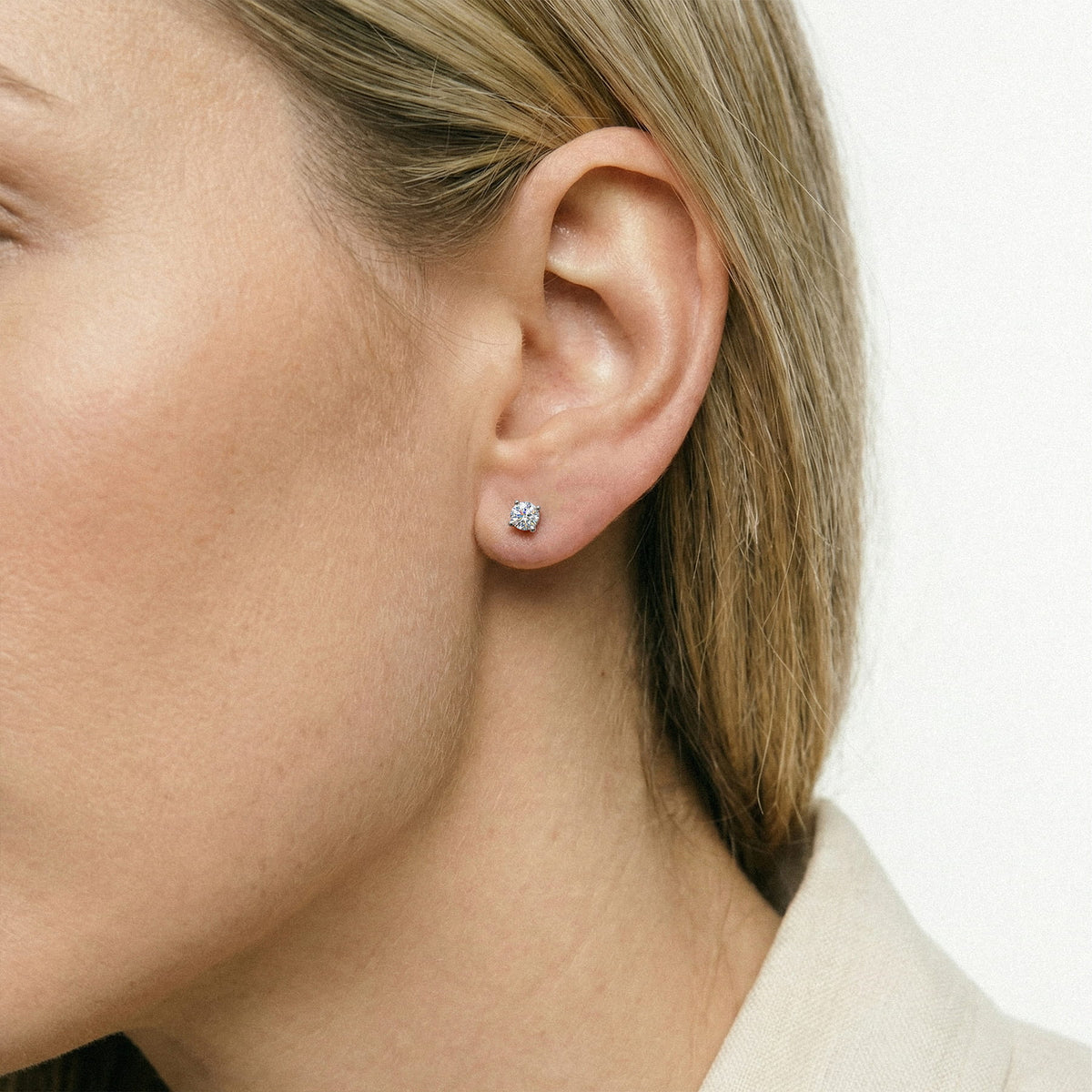 Lab-grown diamond stud earrings worn for styling; additional jewelry is not included | MET-RE-0004-M33