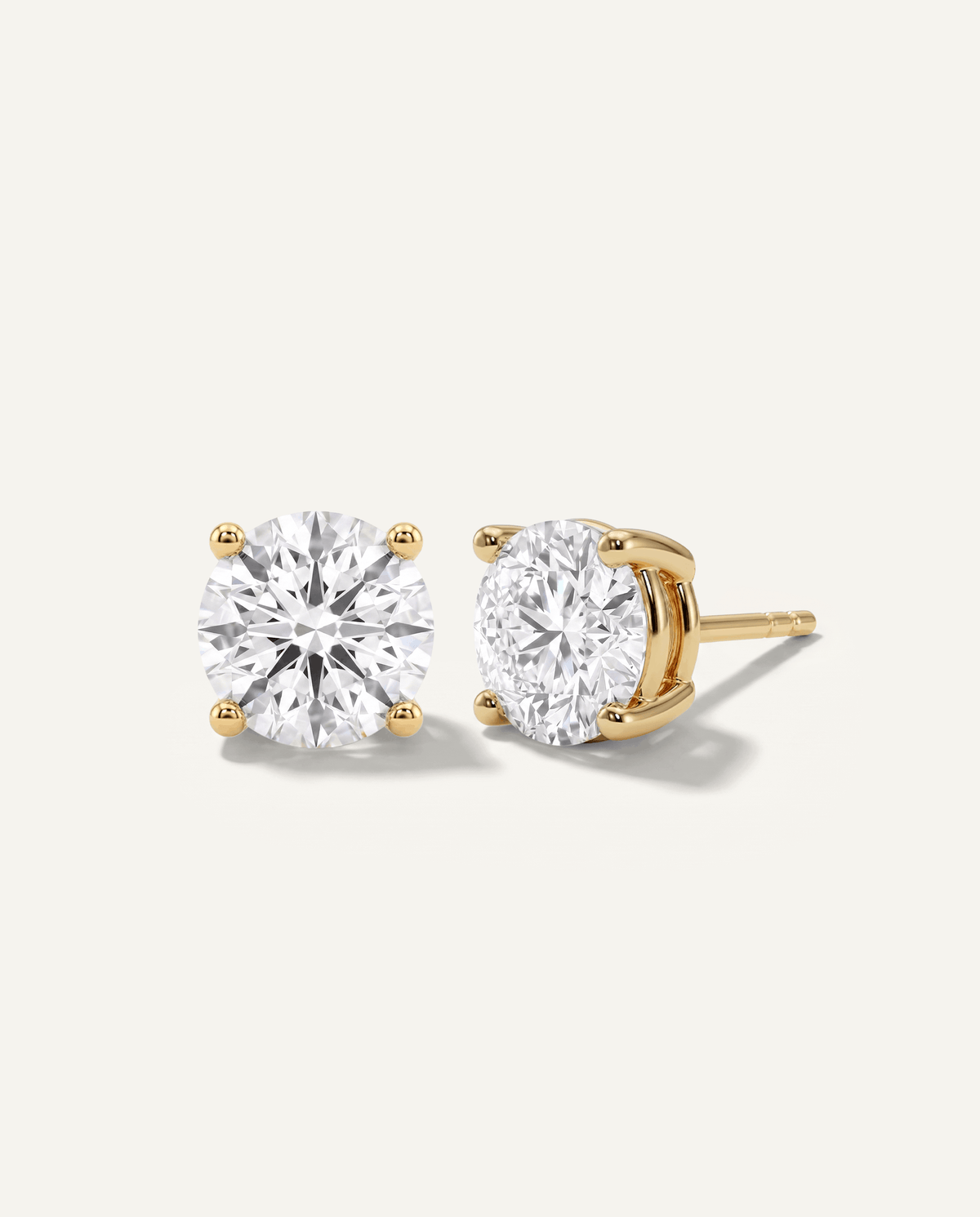 Round lab-grown diamond stud earrings in yellow gold, front and side view | MET-RE-0004-M41