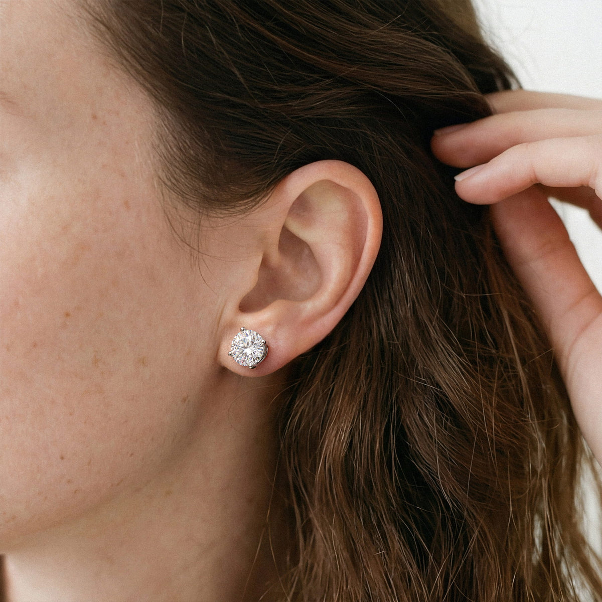 Lab-grown diamond stud earrings worn for styling; additional jewelry is not included | MET-RE-0004-M45