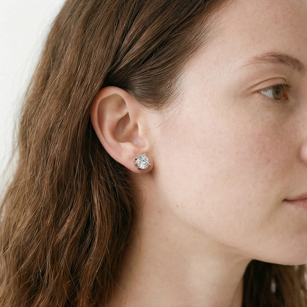 Lab-grown diamond stud earrings worn for styling; additional jewelry is not included | MET-RE-0004-M47