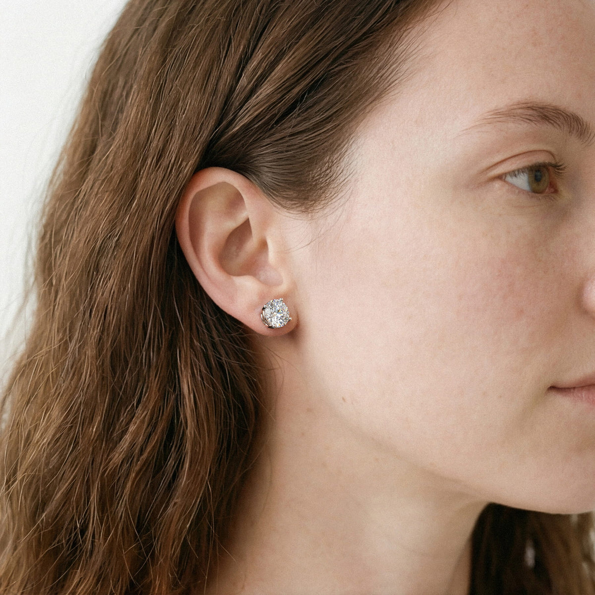 Lab-grown diamond stud earrings worn for styling; additional jewelry is not included | MET-RE-0004-M47
