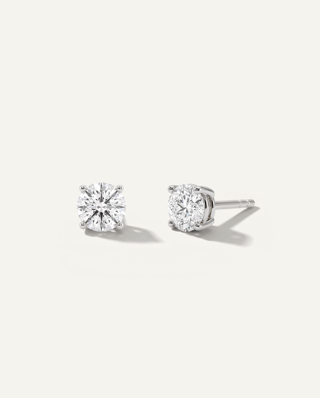 Round lab-grown diamond stud earrings in white gold, front and side view | MET-RE-0005-M08