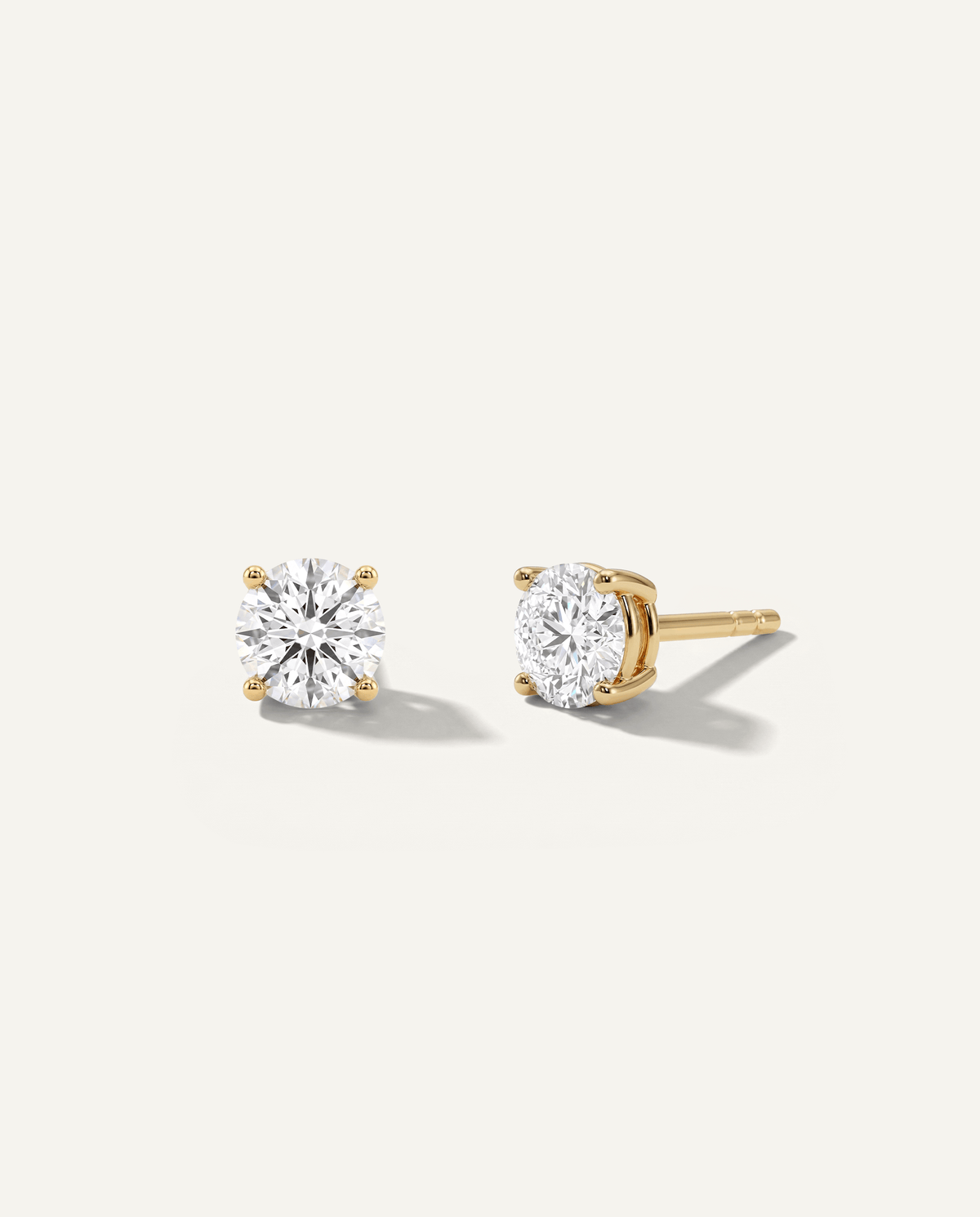 Round lab-grown diamond stud earrings in yellow gold, front and side view | MET-RE-0005-M12