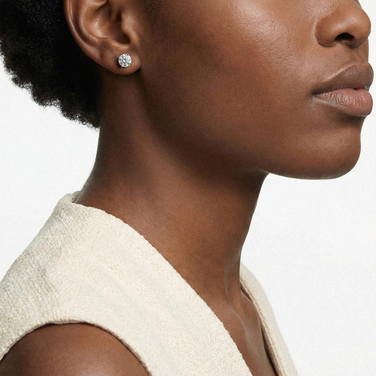 Lab-grown diamond stud earrings worn for styling; additional jewelry is not included | MET-RE-0005-M17