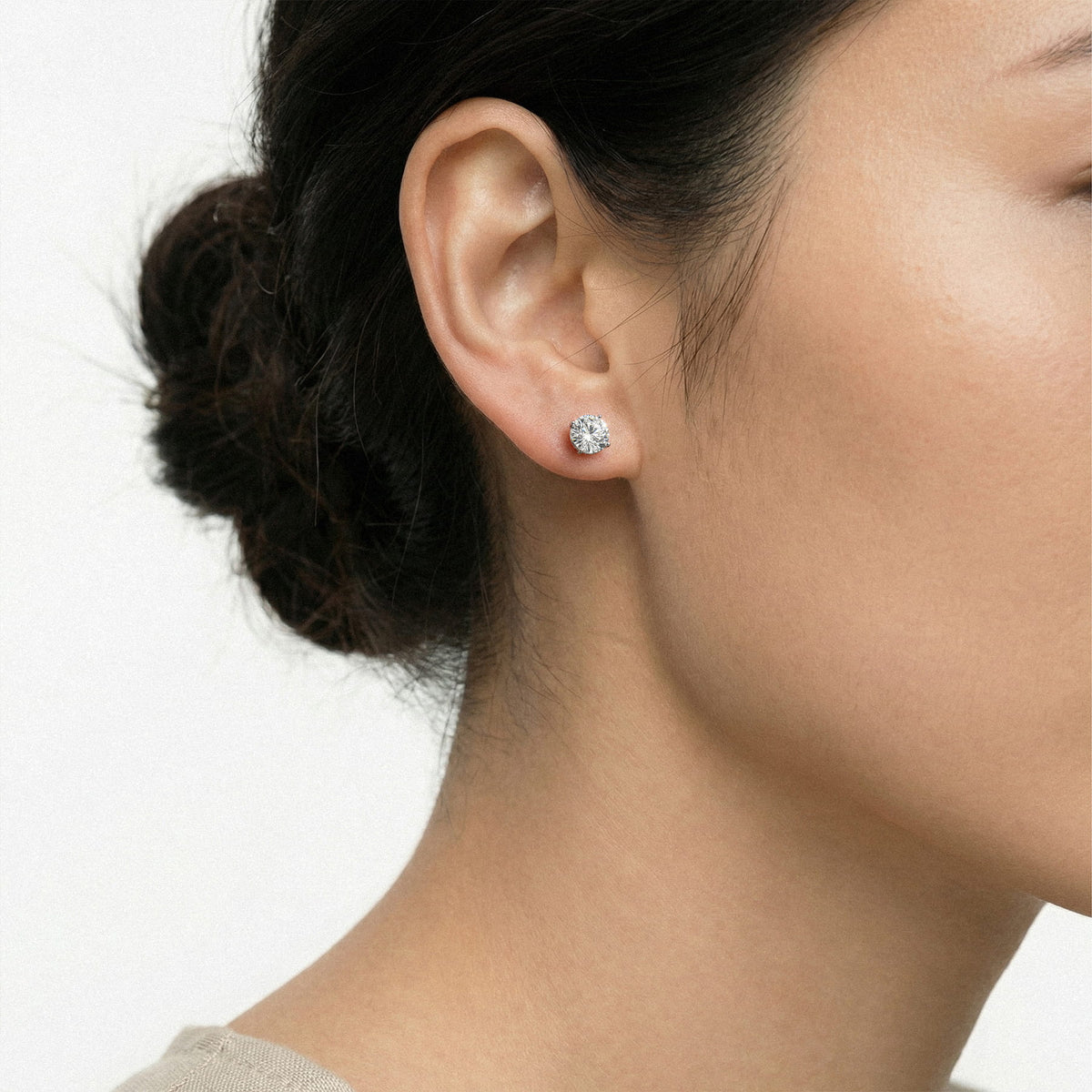 Lab-grown diamond stud earrings worn for styling; additional jewelry is not included | MET-RE-0005-M19