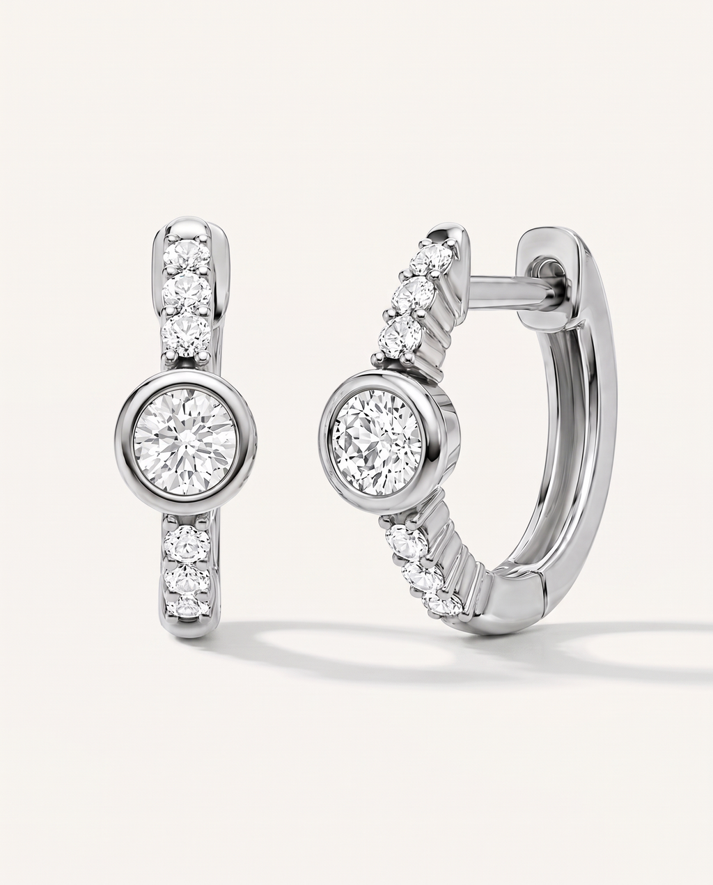 Bezel and Pavé Lab-Grown Diamond Huggie Earrings in white gold, view 1 | MET-RE-0017-M01