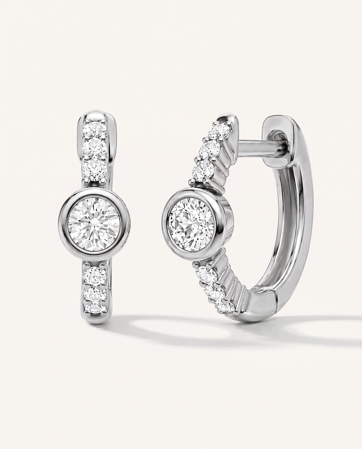Bezel and Pavé Lab-Grown Diamond Huggie Earrings in white gold, view 1 | MET-RE-0017-M01