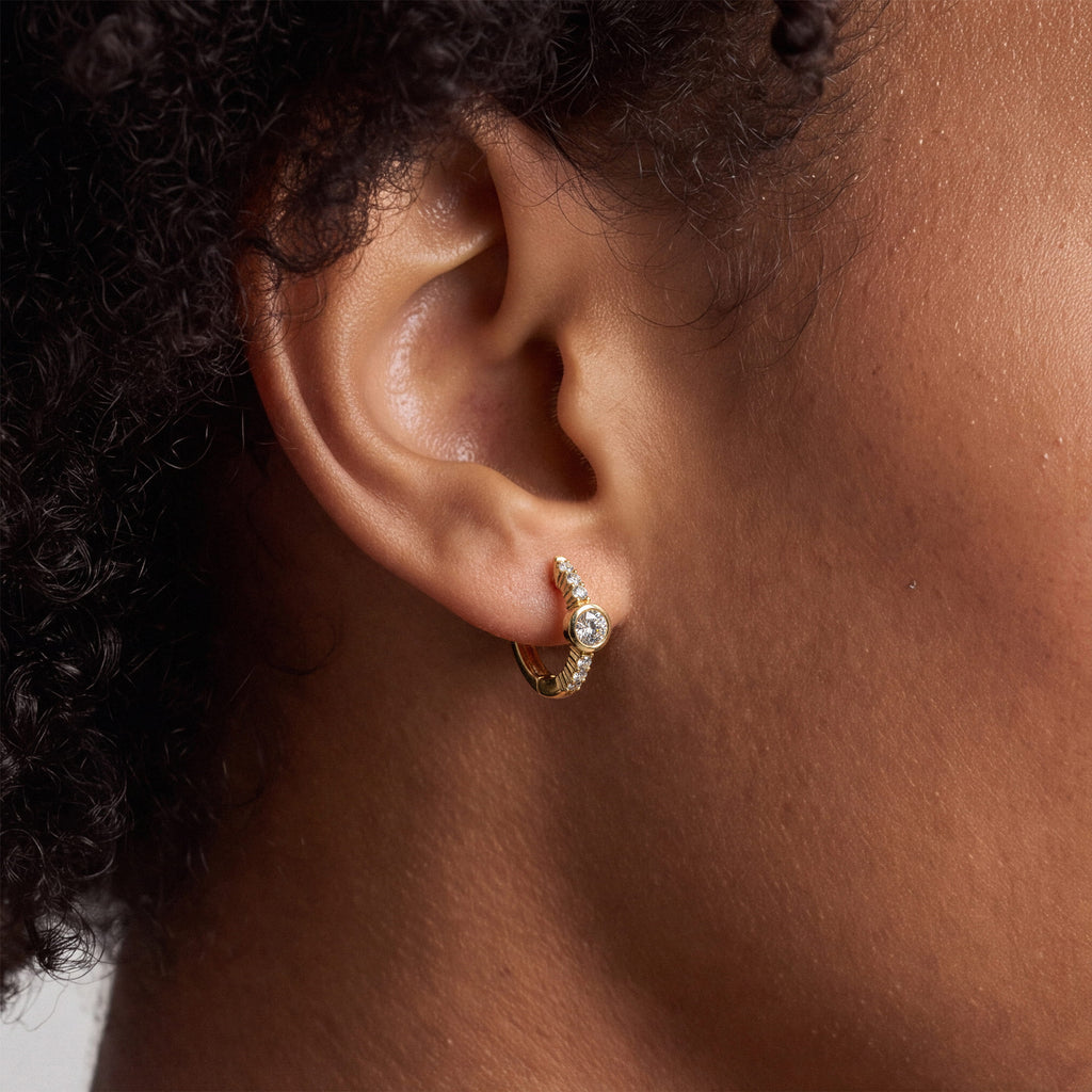 Bezel and Pavé Lab-Grown Diamond Huggie Earrings worn for styling | MET-RE-0017-M02