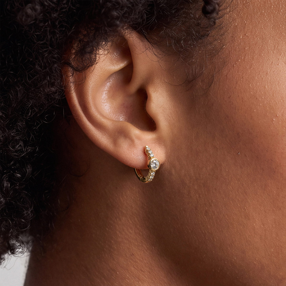 Bezel and Pavé Lab-Grown Diamond Huggie Earrings worn for styling | MET-RE-0017-M02