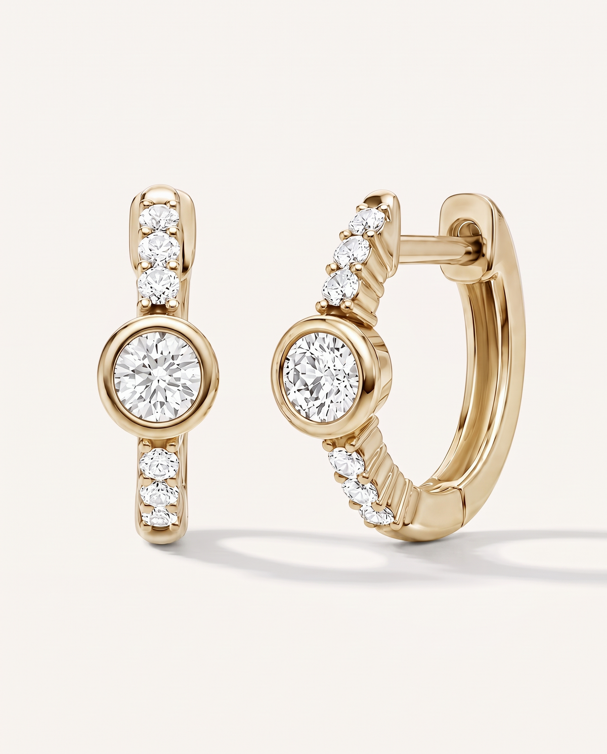 Bezel and Pavé Lab-Grown Diamond Huggie Earrings in yellow gold, view 1 | MET-RE-0017-M04
