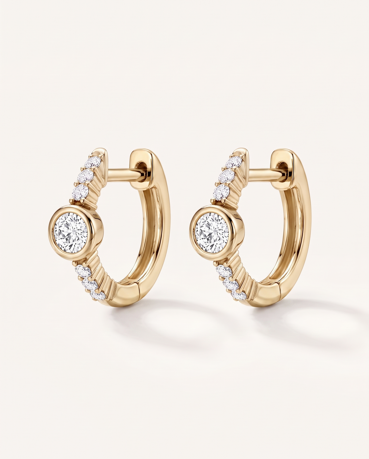 Bezel and Pavé Lab-Grown Diamond Huggie Earrings in yellow gold, view 3 | MET-RE-0017-M05