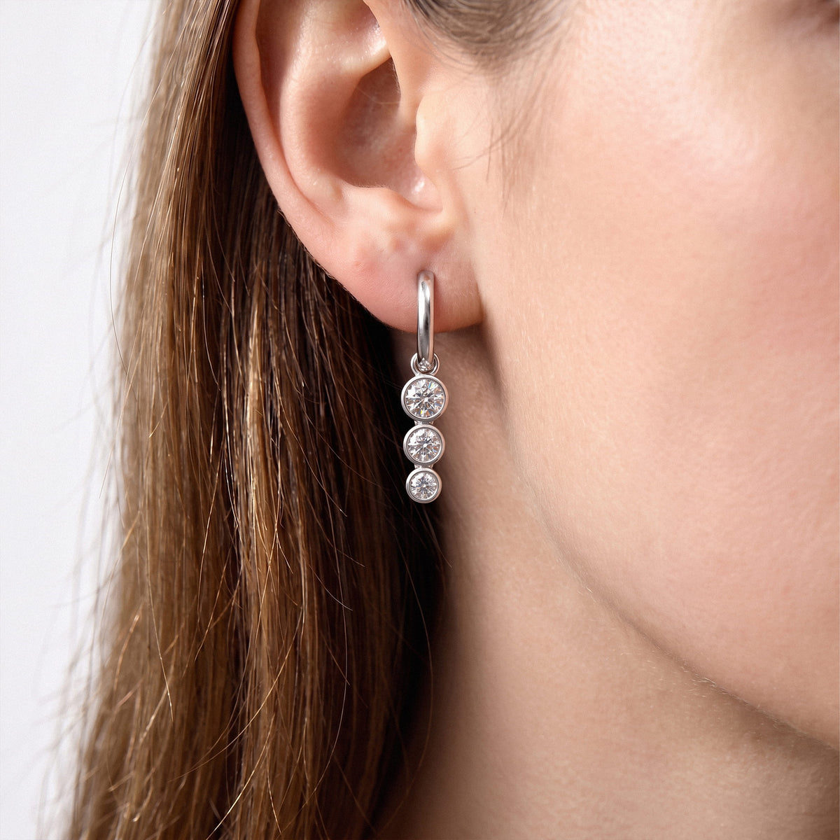 Triple Bezel Lab-Grown Diamond Dangle Huggie Earrings worn for styling | E040-M04