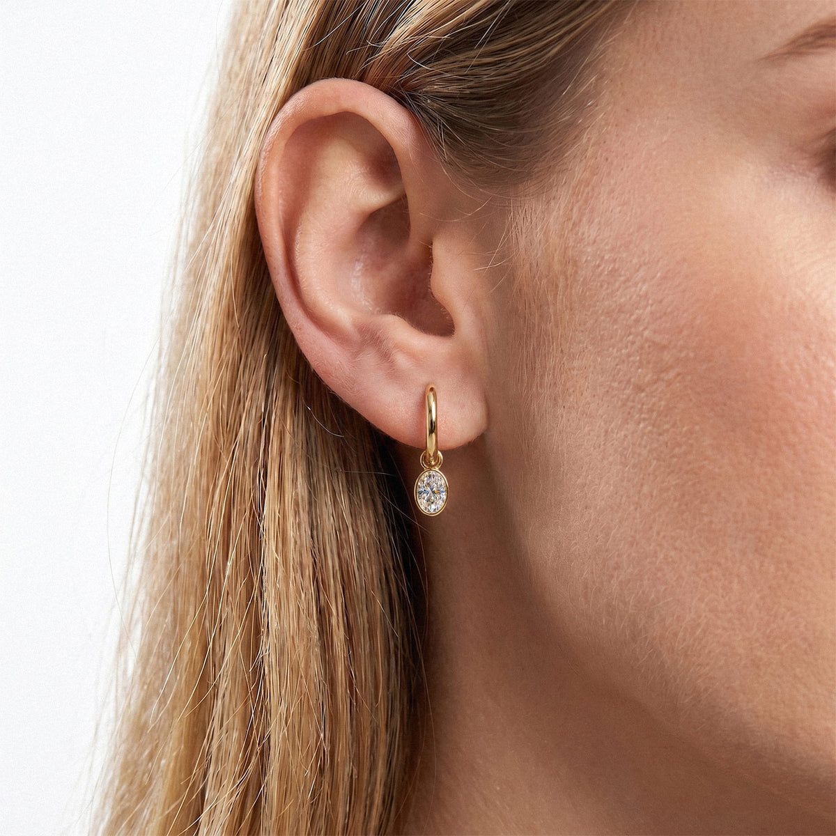 Oval Bezel Lab-Grown Diamond Dangle Huggie Earrings worn for styling | E041-M04