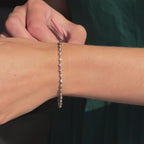 MET-WB-0012 | 14K Yellow Gold | LGBT0130 | Yellow Gold Bubble Bezel Tennis Bracelet (1ctw) | LGBT0130-hand.mp4