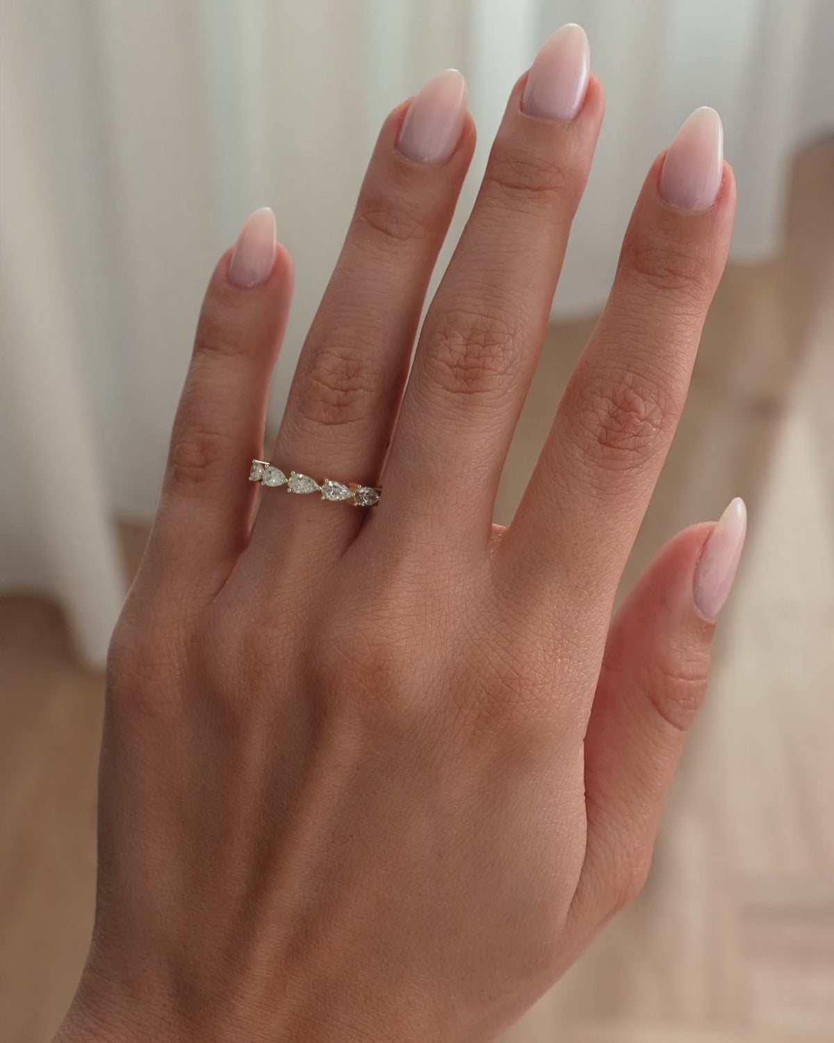 MET 0427 yellow-gold wedding ring in an on-hand and hand-held lifestyle video.